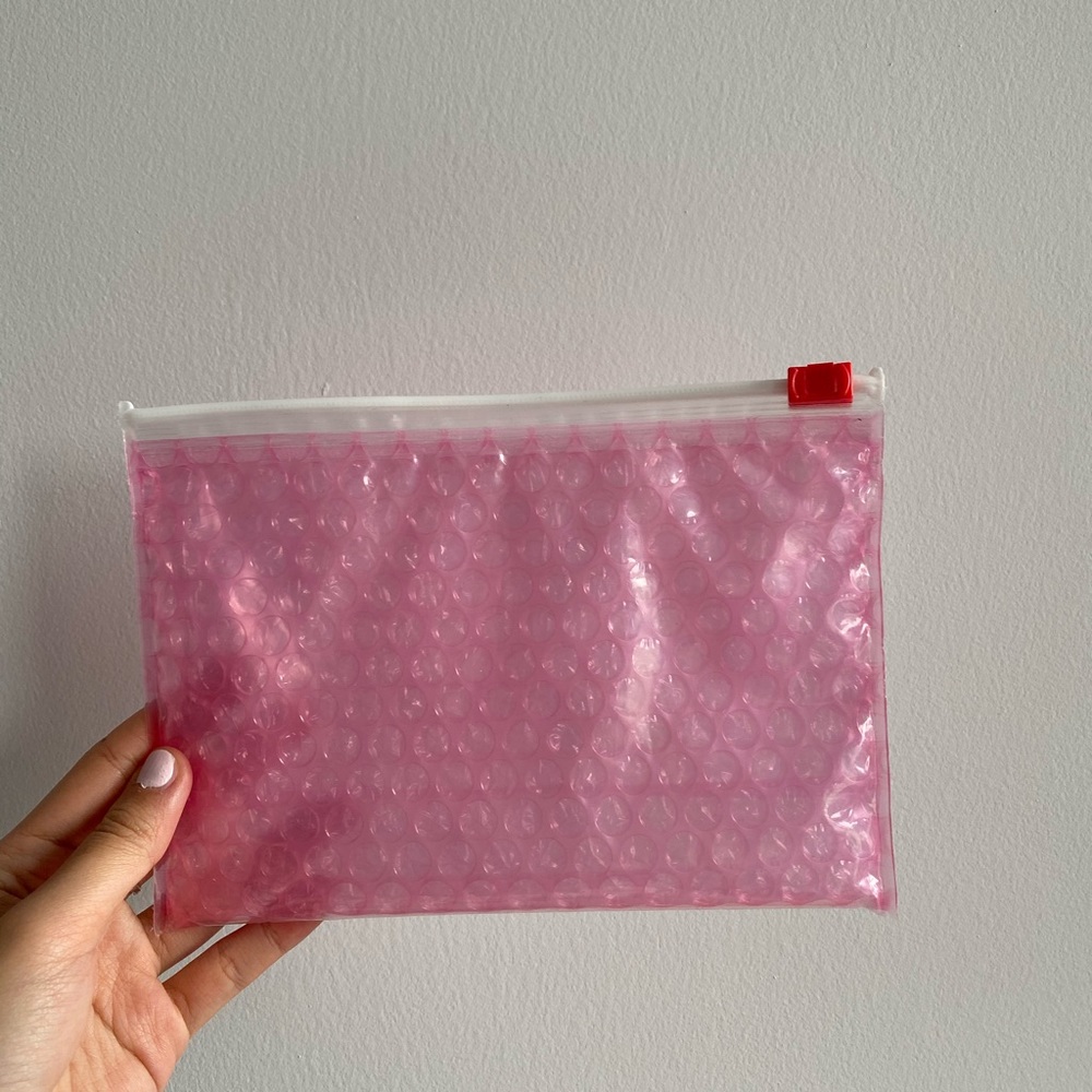 Glossier pink cosmetic bag